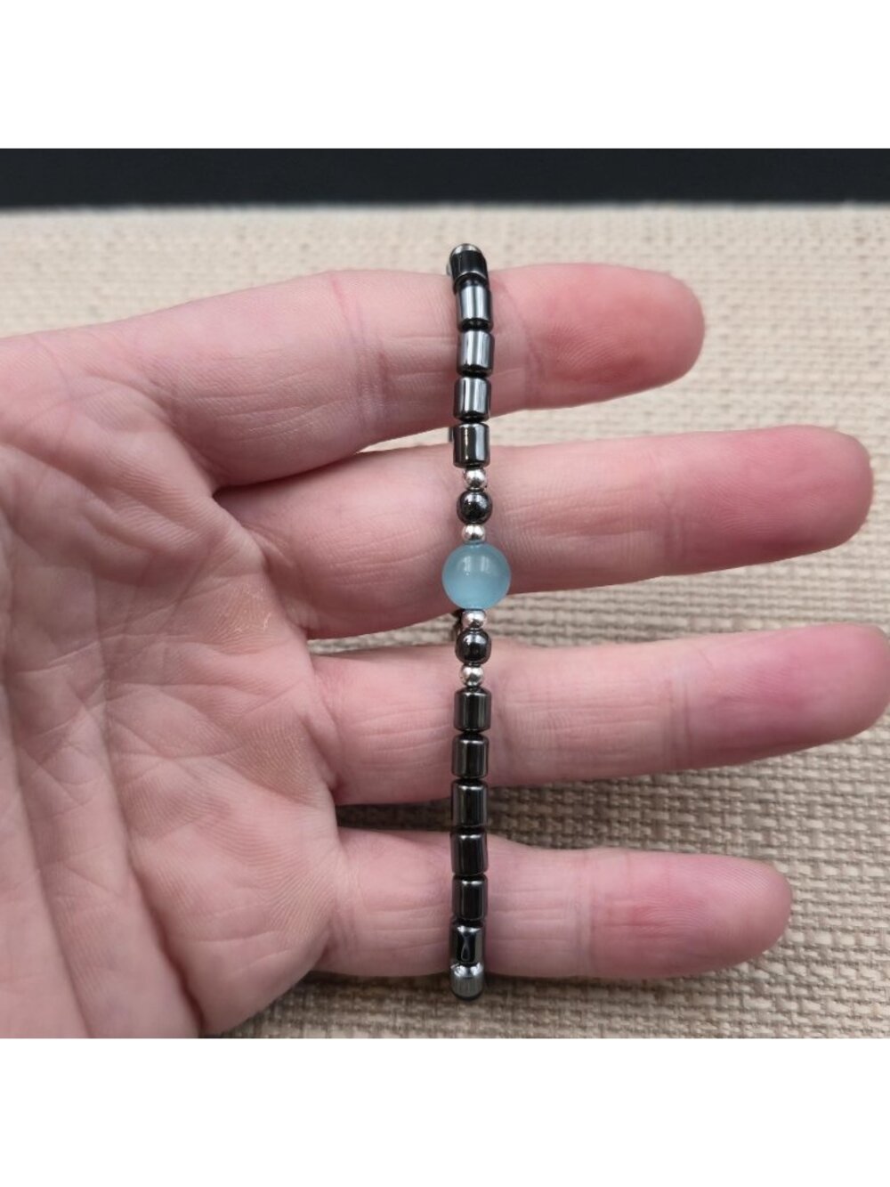 7 Inch Hematite Cylinder Bracelet with Light Blue Cat's Eye Focal Bead Bracelet - Picture 2 of 6